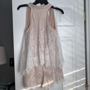 White lace romper! It’s so cute on.